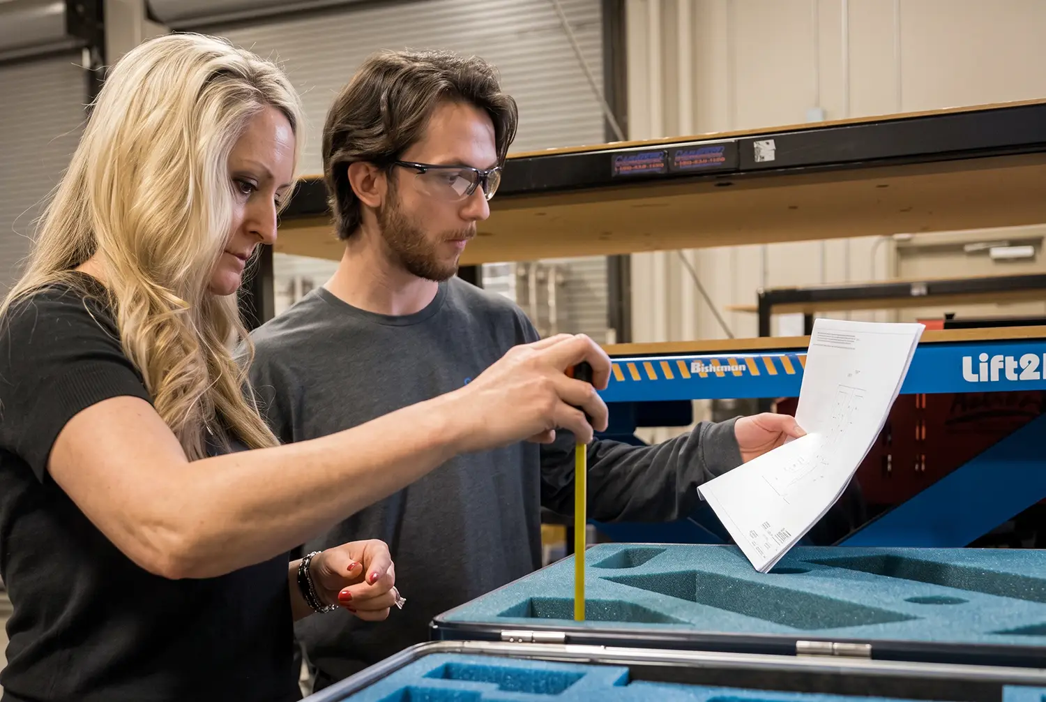 CaseTech team members checking a part against specification